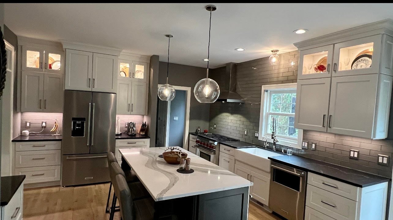 Installed quartz countertop in a Brookfield, Wisconsin kitchen with a waterfall edge and undermount sink, edge profile detail visible