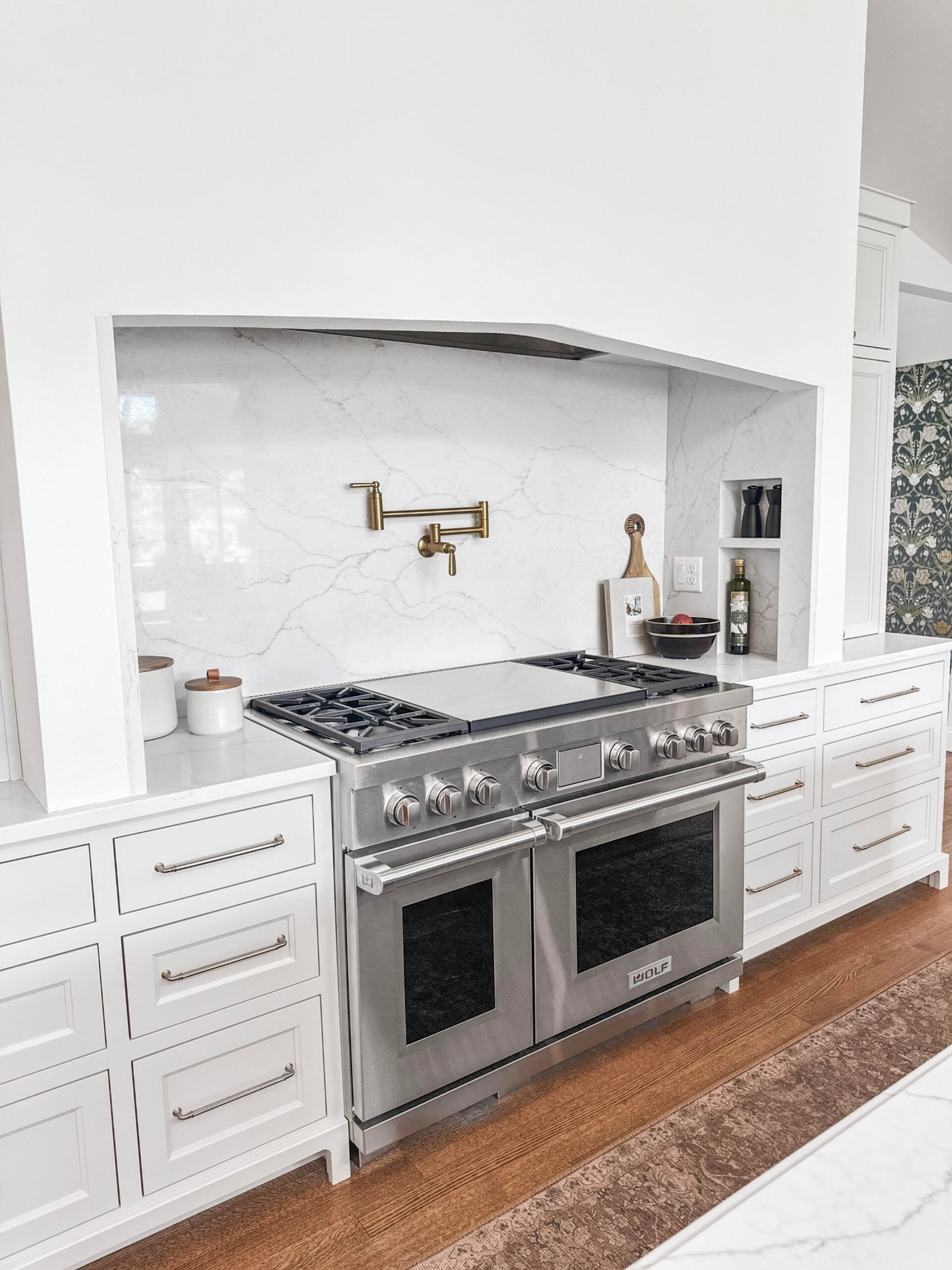 Homeowner comparing three written kitchen remodel quotes at a kitchen table