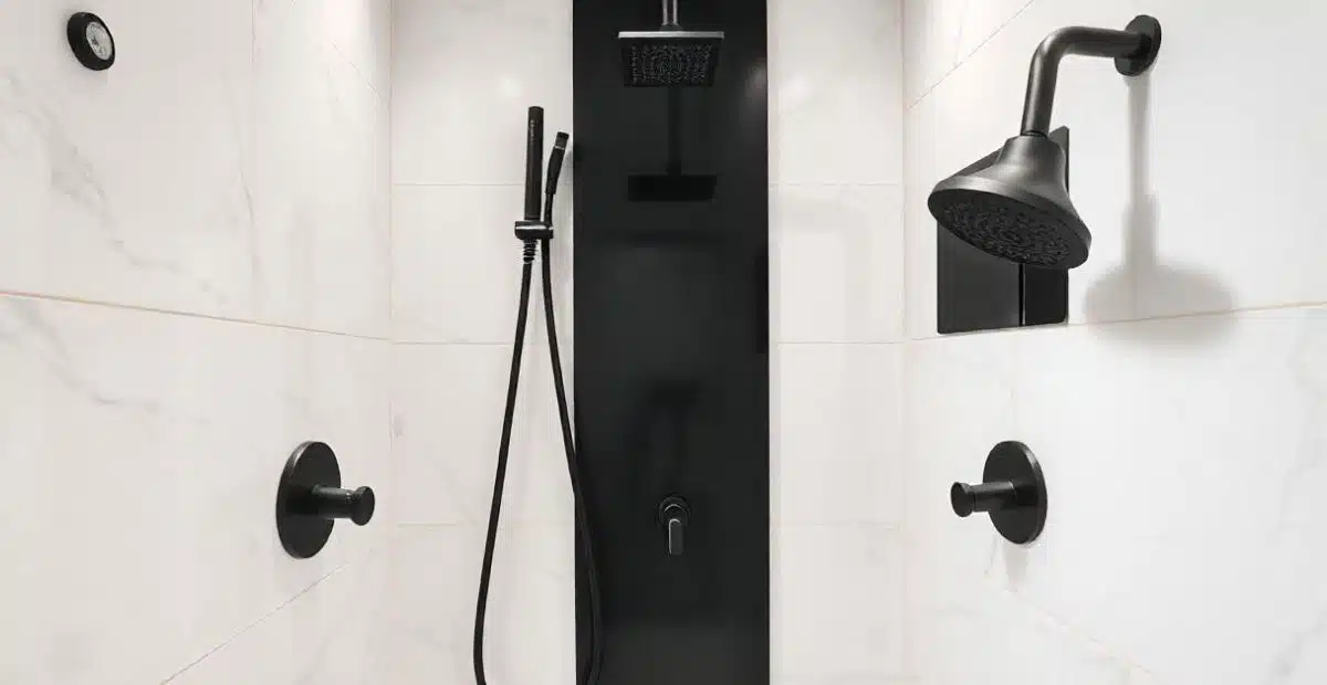 Matte black shower fixtures and rain head in a modern bathroom remodel in Wisconsin