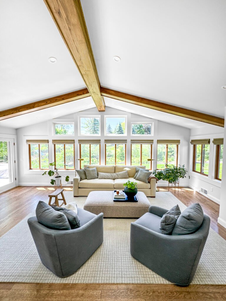 Vaulted great room remodel with an exposed ridge beam and clerestory windows in Hartland, Wisconsin