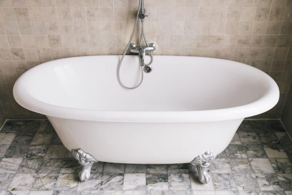 A small bathroom bathtub with shower