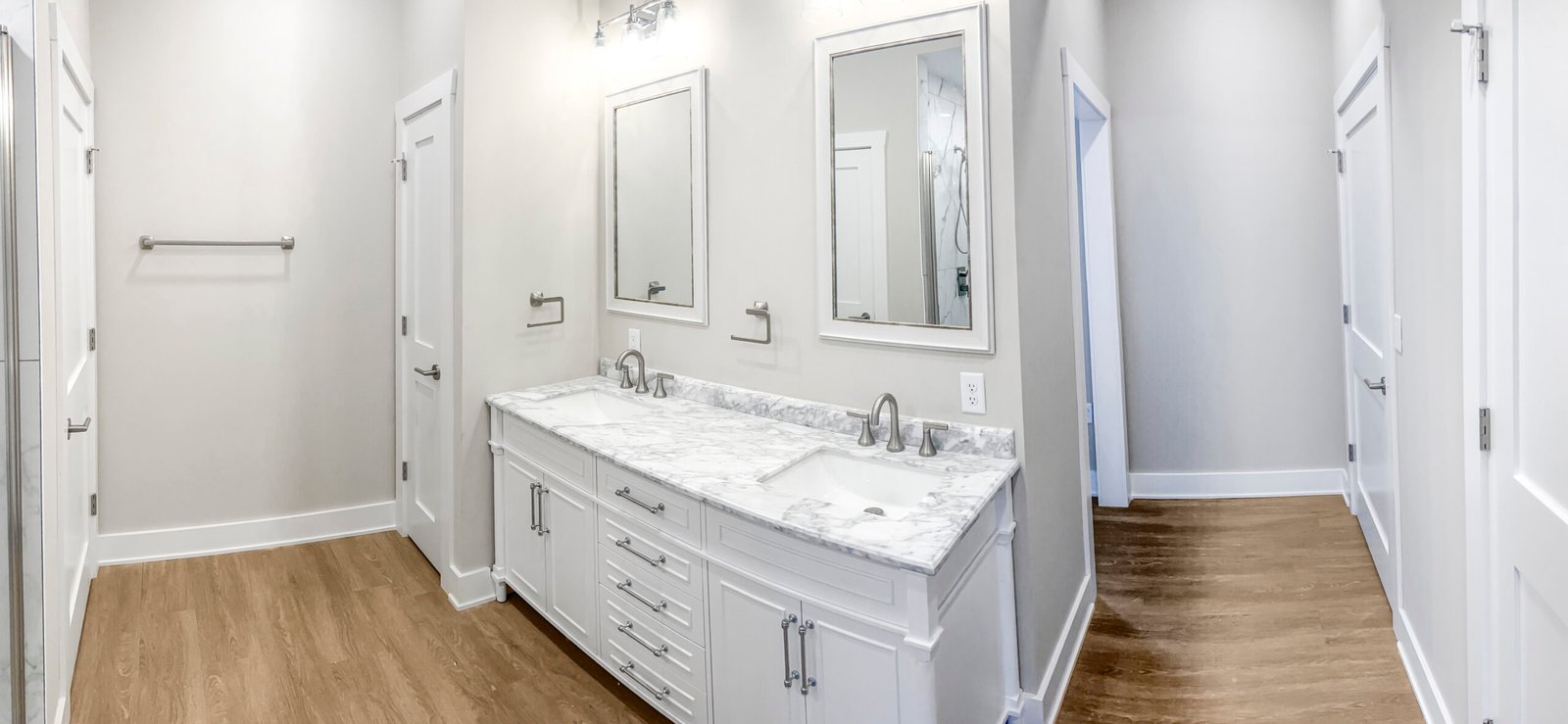 Waukesha homeowner reviewing bathroom remodel scope with a contractor at a kitchen table