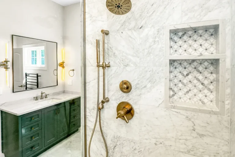 Green vanity with brass fittings and a basketweave niche, a completed T And J bathroom remodel in Southeastern Wisconsin